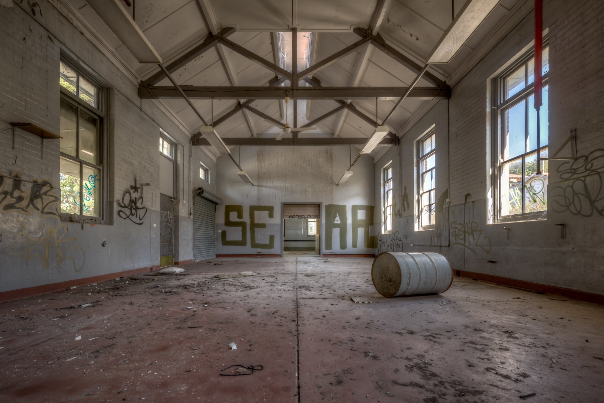 Arches at Waterfall Sanatorium, a large empty room in Waterfall Sanatorium.