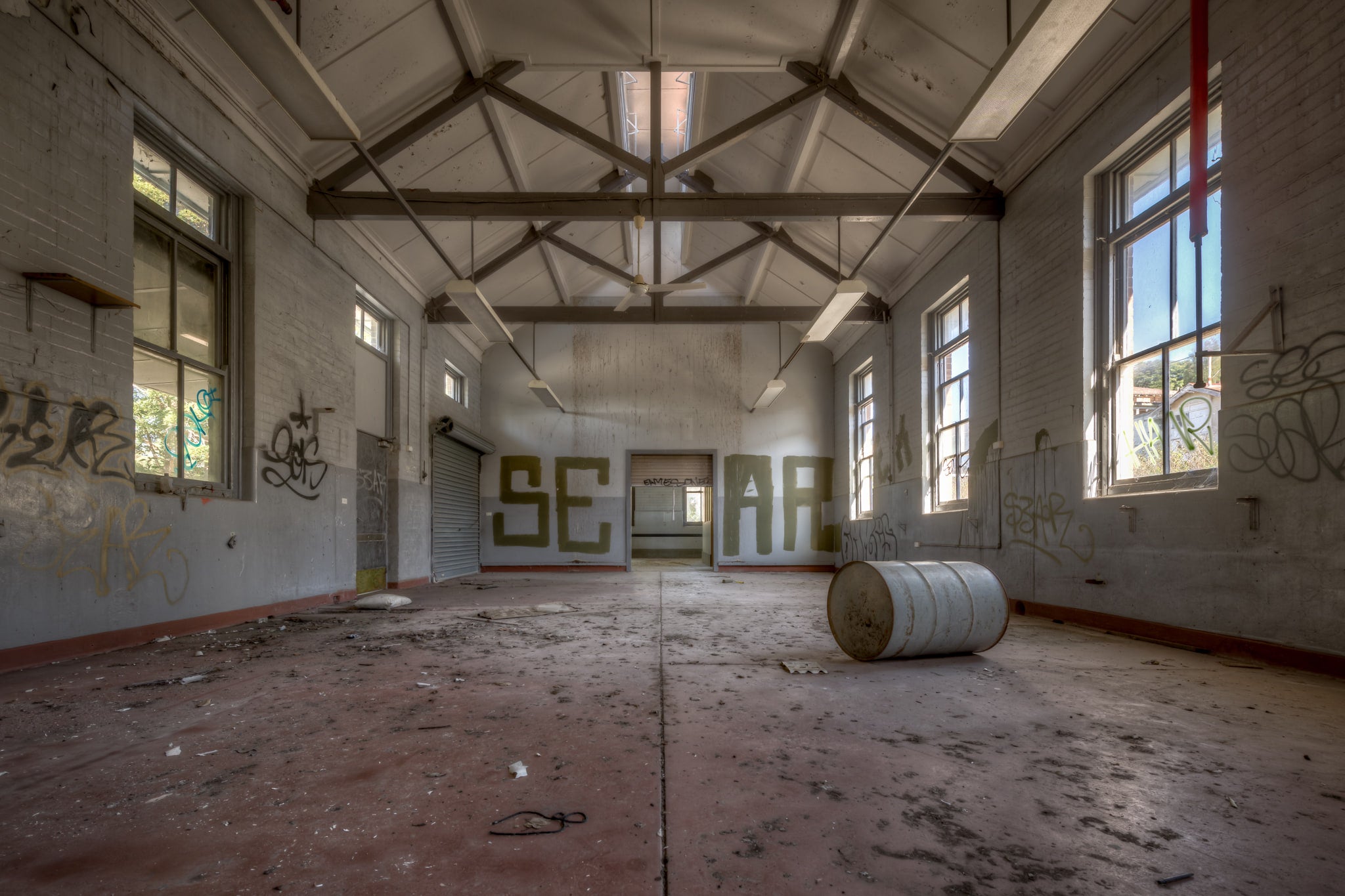 Arches at Waterfall Sanatorium, a large empty room in Waterfall Sanatorium.