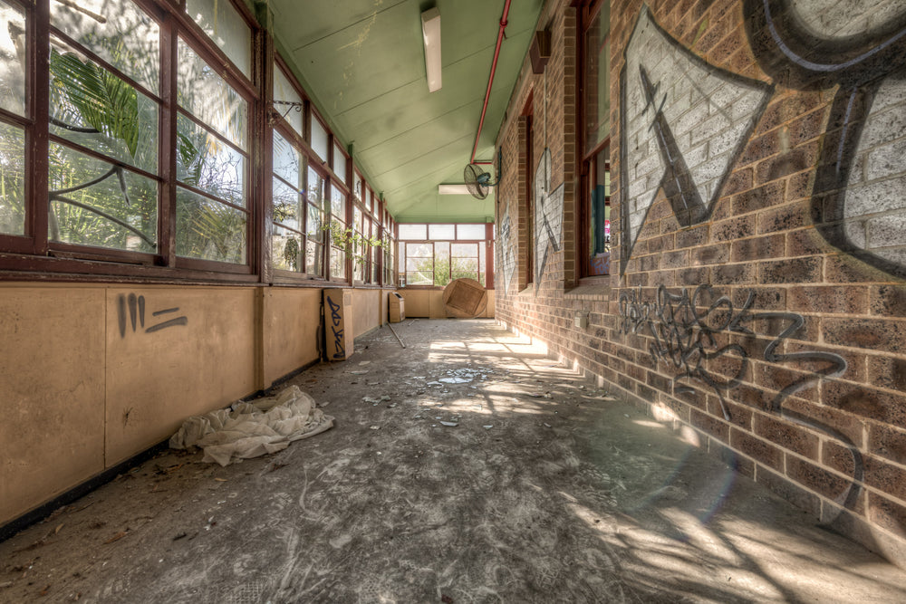 Brick Annex at Waterfall Sanatorium, a covered verandah runs along the brick annex, its pale green timber ceiling still.