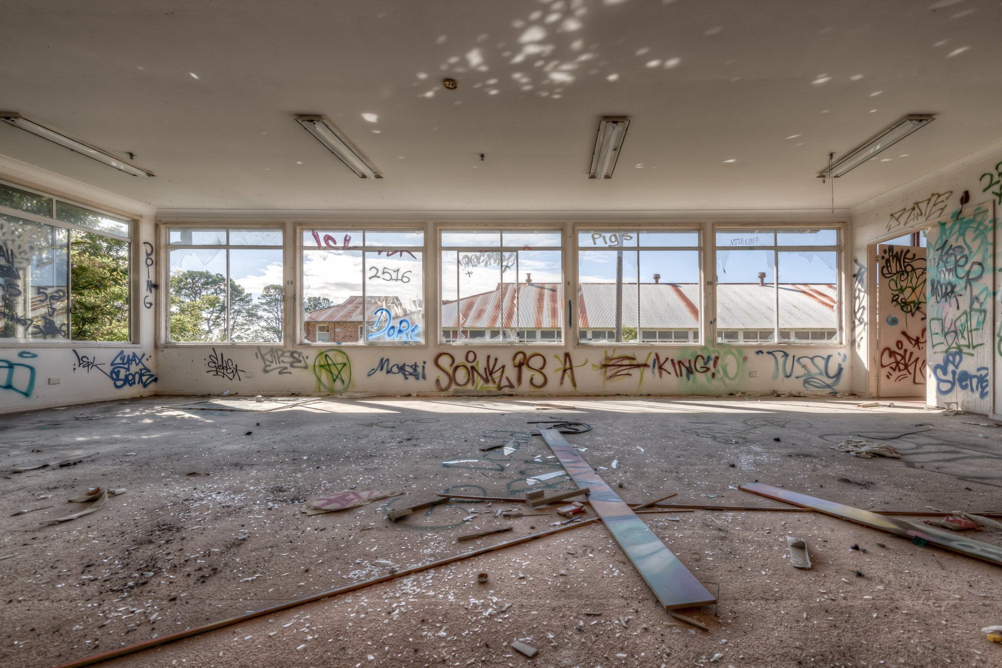Daylight at Waterfall Sanatorium, a wide room stripped bare.