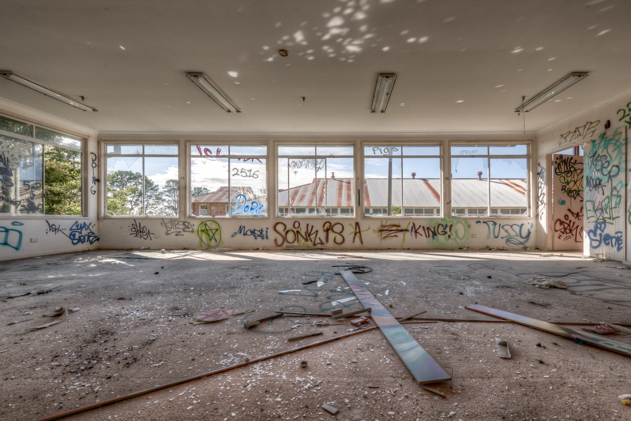 Daylight at Waterfall Sanatorium, a wide room stripped bare.