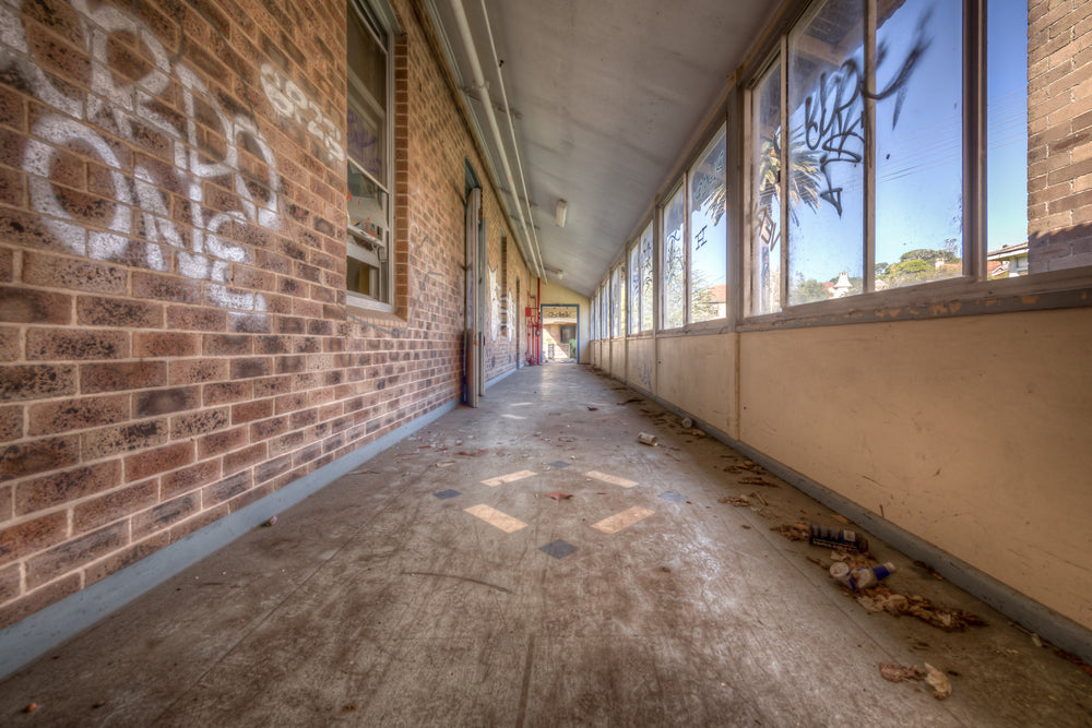 Fibro Annex at Waterfall Sanatorium, a covered walkway runs the length of a fibro and brick annex building.