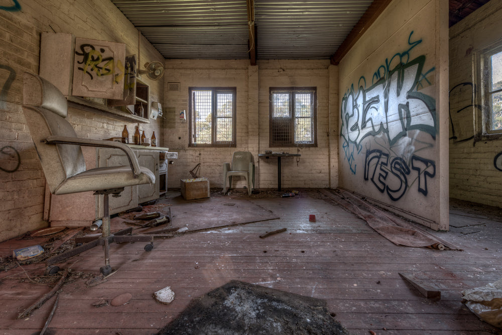 The Shed at Waterfall Sanatorium, a cream brick room with a corrugated iron ceiling.