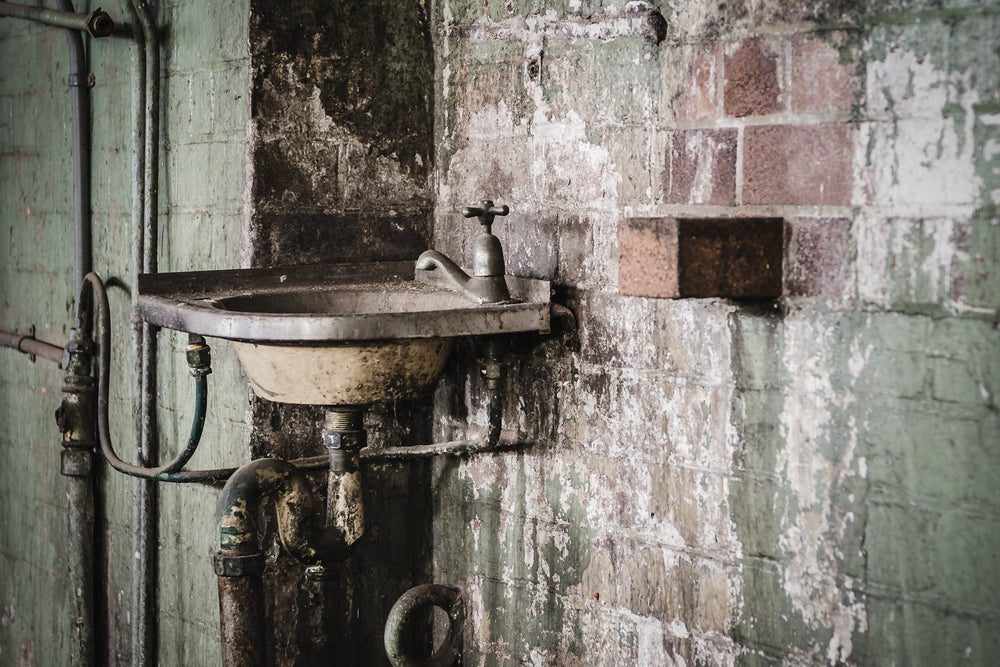 Hand Basin at West Ryde Pumping Station, an old hand basin within the boiler house, complete with a soap brick, jutting out.