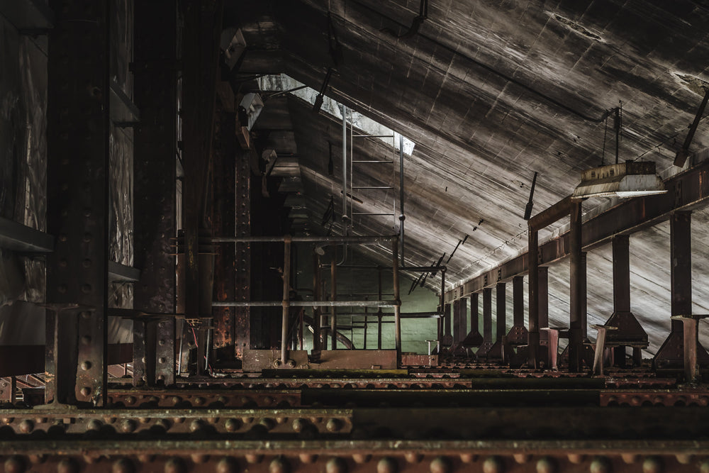 Rafters at West Ryde Pumping Station, weathered timber rafters stretch across the cavernous interior of the West Ryde.