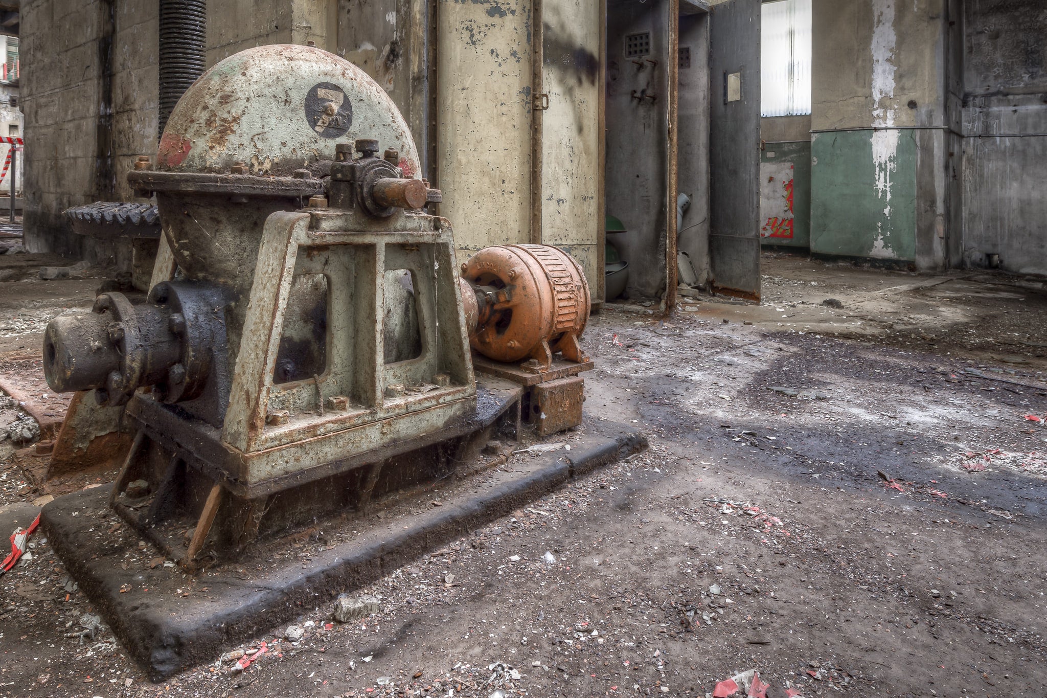 Basement Pump at White Bay Power Station, a centrifugal pump sits bolted to a concrete plinth in the basement level.