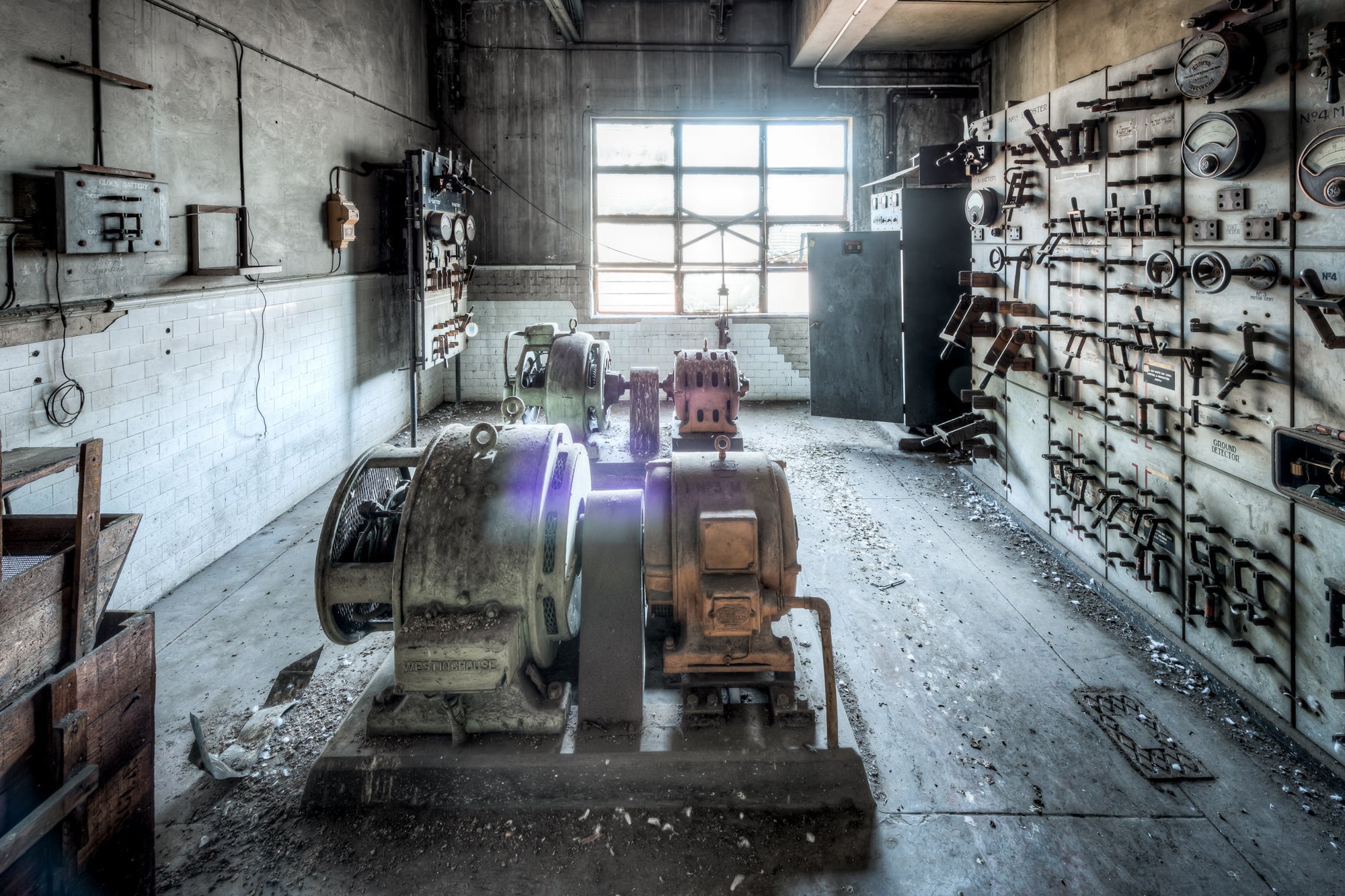 Battery Room at White Bay Power Station, a Westinghouse motor-generator set sits bolted to a concrete plinth in the centre.