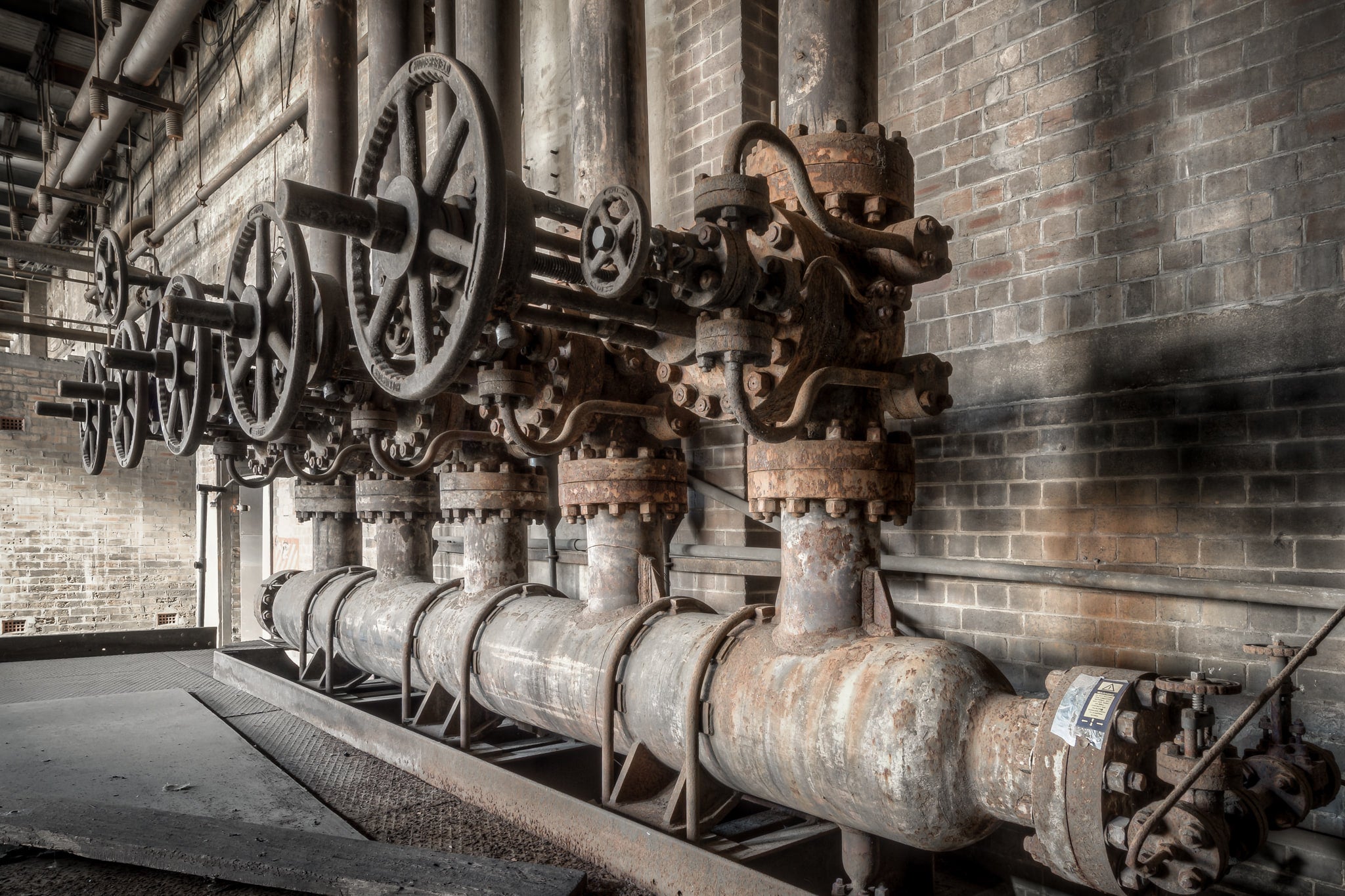 White Bay Power Station Boiler Water Valves – Industrial Print at White Bay Power Station, a row of cast iron gate valves.