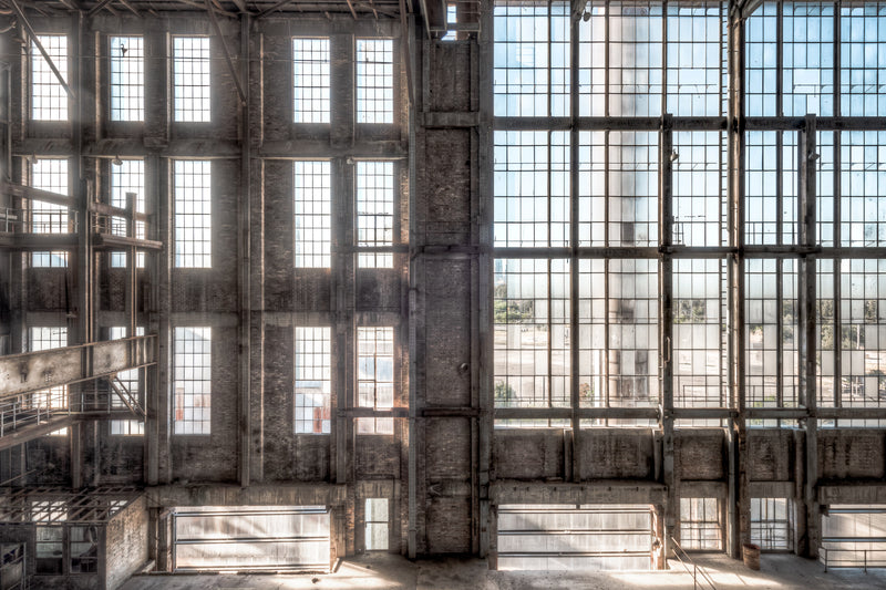 Glass Curtain at White Bay Power Station, a towering mosaic of glass and steel, where light filters through dust-streaked.