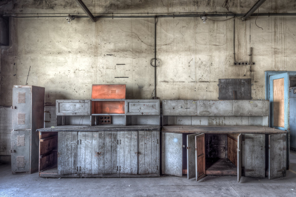 Switch House Workbench at White Bay Power Station, grey-painted steel workbenches run the length of the back wall.
