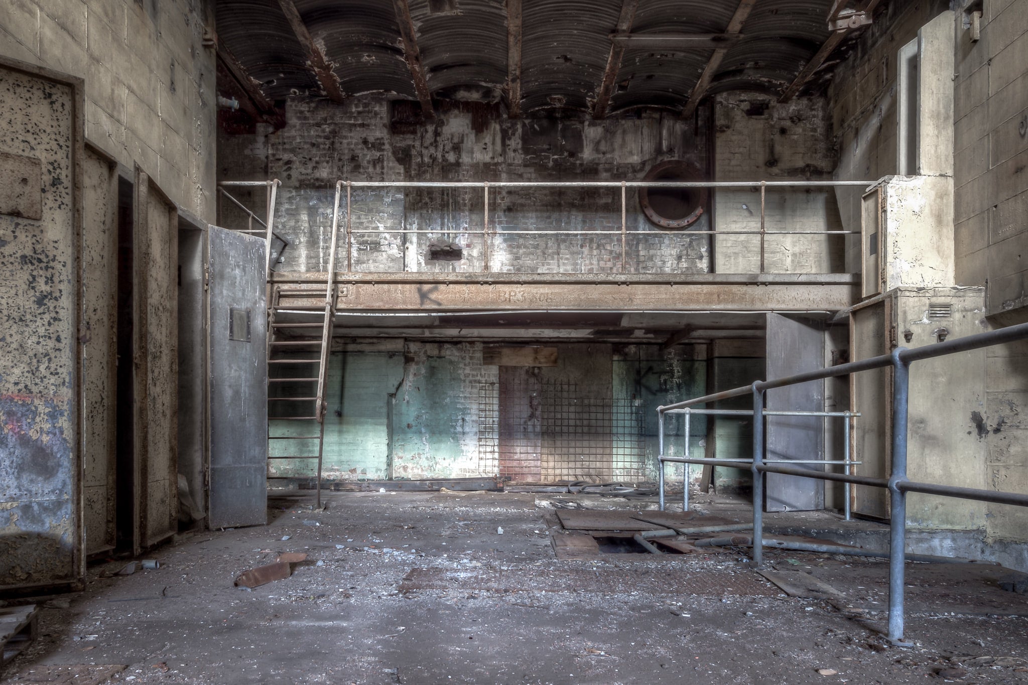 Turbine Hall Basement Storage at White Bay Power Station, a steel mezzanine walkway spans the rear wall, reached.