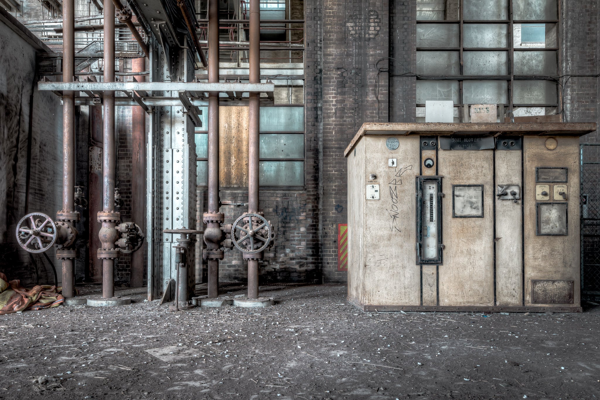 Turbine Hall Equipment at White Bay Power Station, a soot blower control panel sits against the brick wall of White Bay's.
