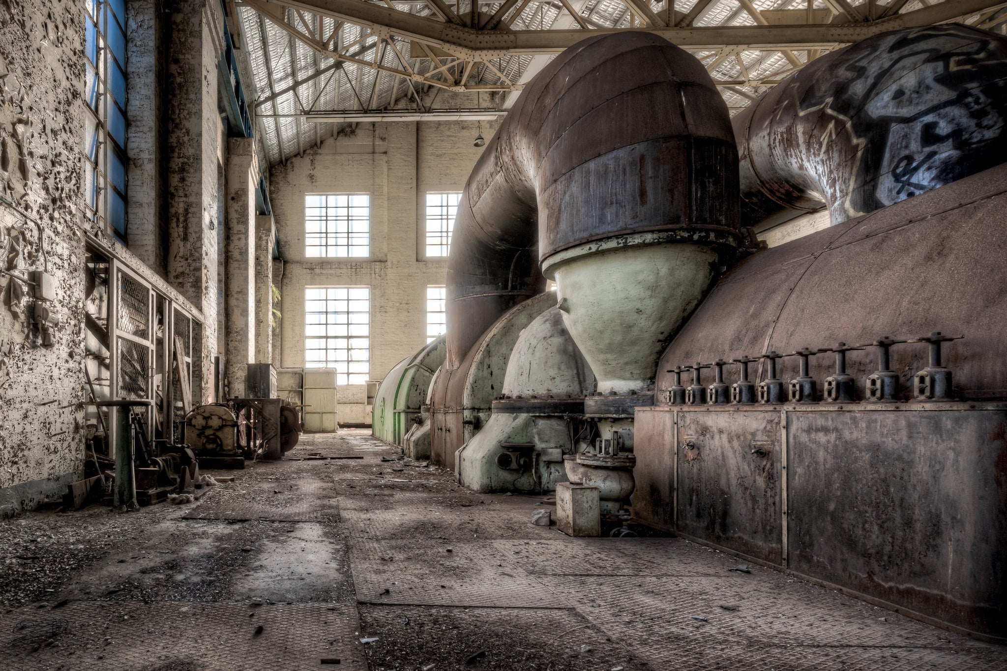 Turbine Hall Operator Level at White Bay Power Station, the Parsons turbine looms in a long row, its massive exhaust ducts.