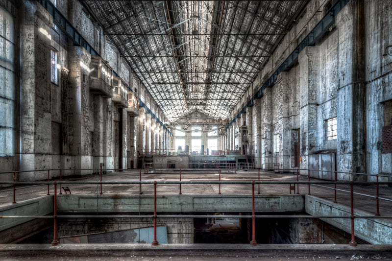 Turbine Hall at White Bay Power Station, reinforced concrete walls rise three storeys on each side, their surfaces stained.