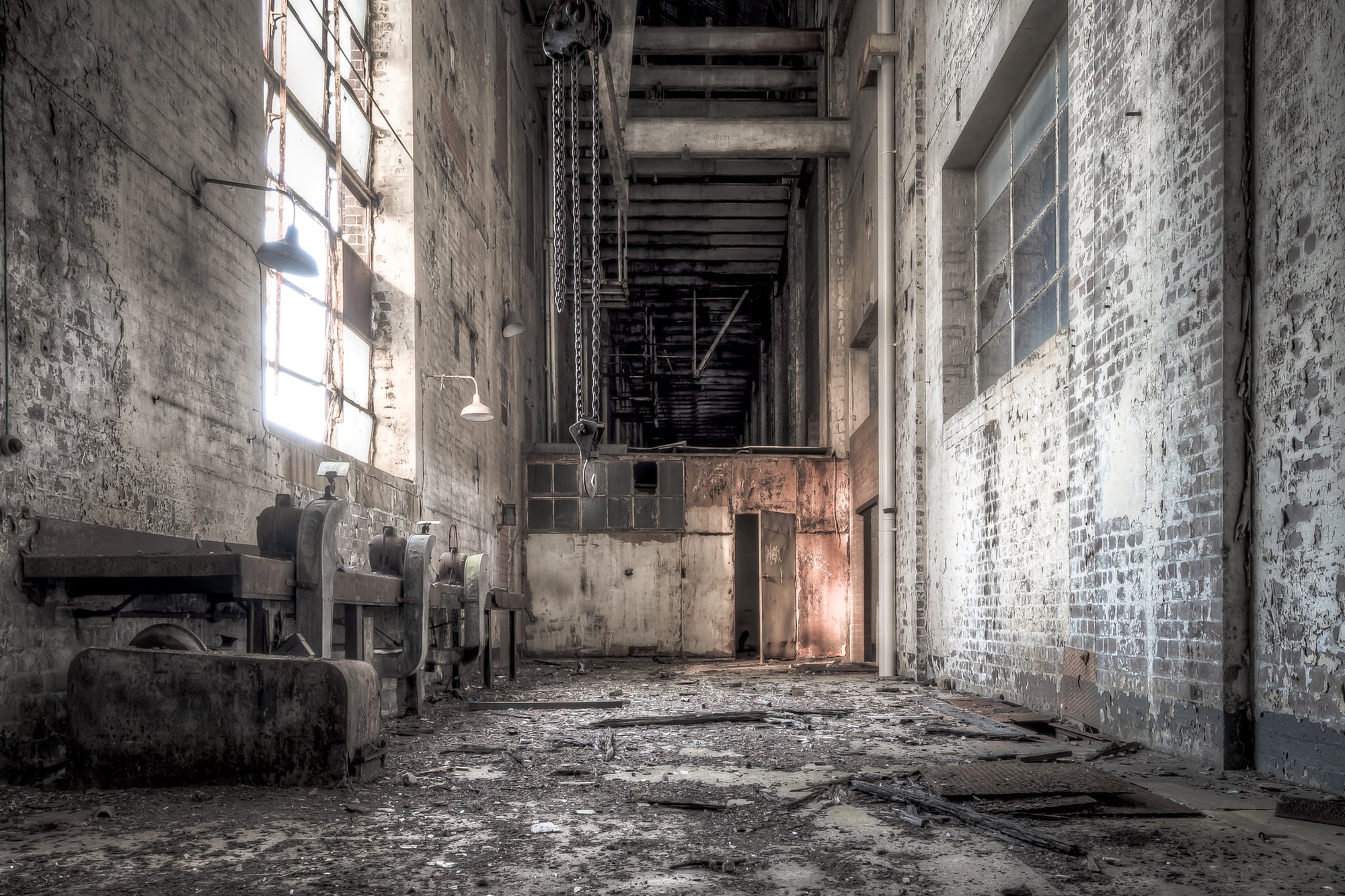 Workshop Facing South at White Bay Power Station, a narrow corridor between brick walls rises two storeys high.
