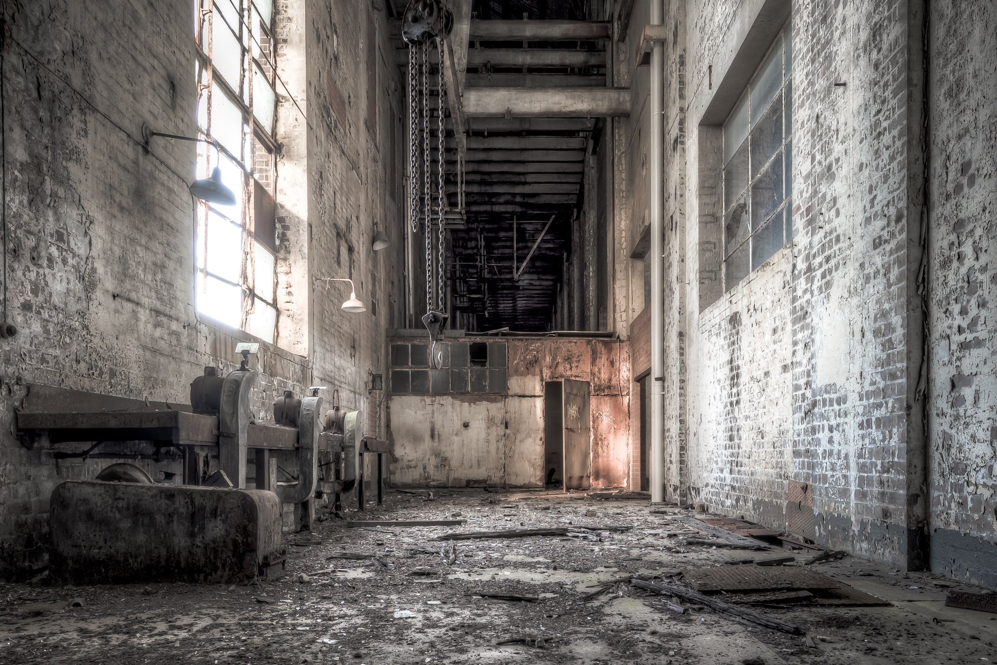 Workshop Facing South at White Bay Power Station, a narrow corridor between brick walls rises two storeys high.