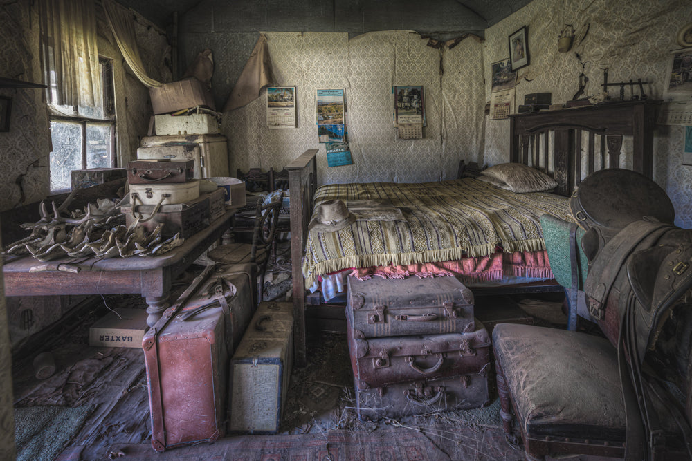 Main Bedroom Cross View at Woolla, a single bed sits against the far wall, its striped coverlet still stretched flat.