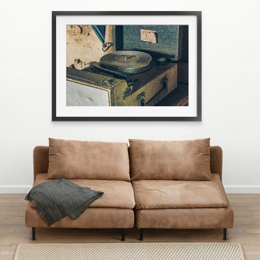 An open portable record player with a dusty ribbed metal turntable and worn fabric case, photographed in the Deua River Valley.