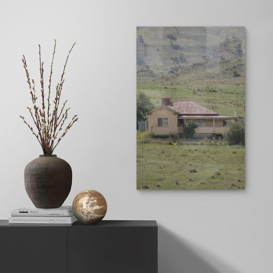 Boco Homestead at A Place to Call Home, an abandoned weatherboard farmstesd perched on a hillside.