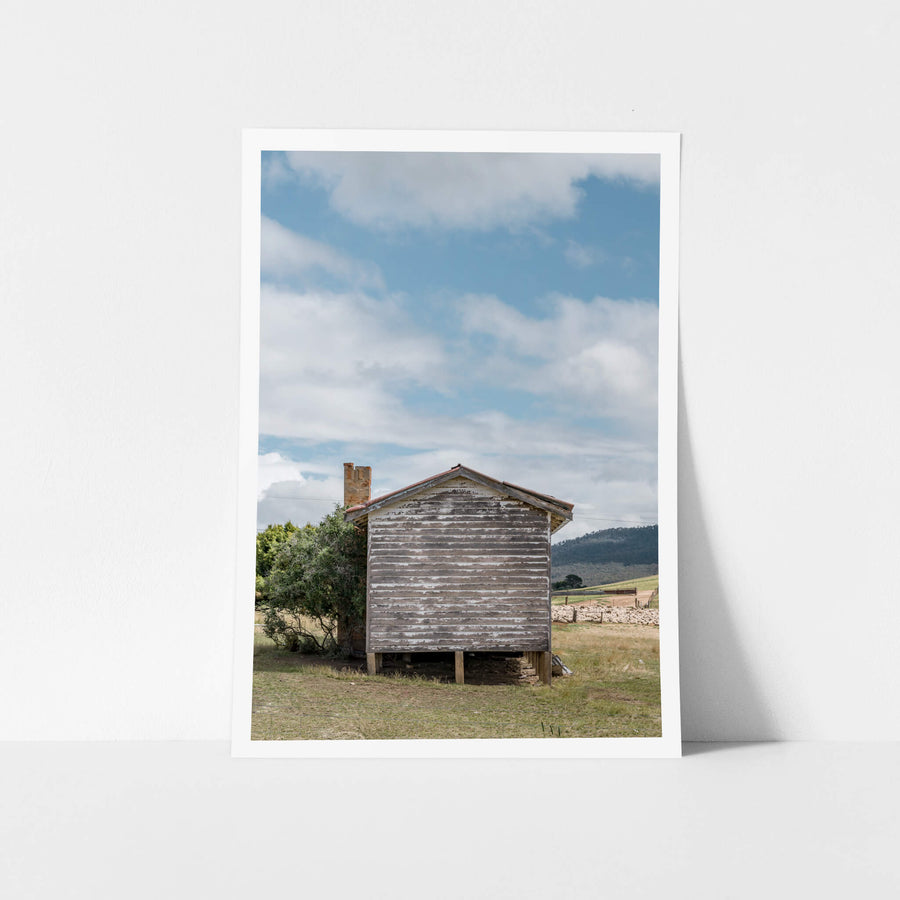 Delegate Shearers Rear at A Place to Call Home, a weatherboard cottage sits raised on timber stumps in dry pastoral land.