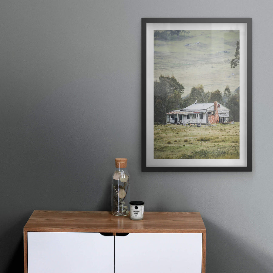 Home In The Valley at A Place to Call Home, a weatherboard farmhouse sits alone in open grazing country.