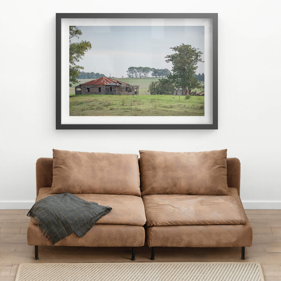 Hunter Homestead at A Place to Call Home, a weatherboard farmhouse sits low in open paddock, its hip roof a patchwork.