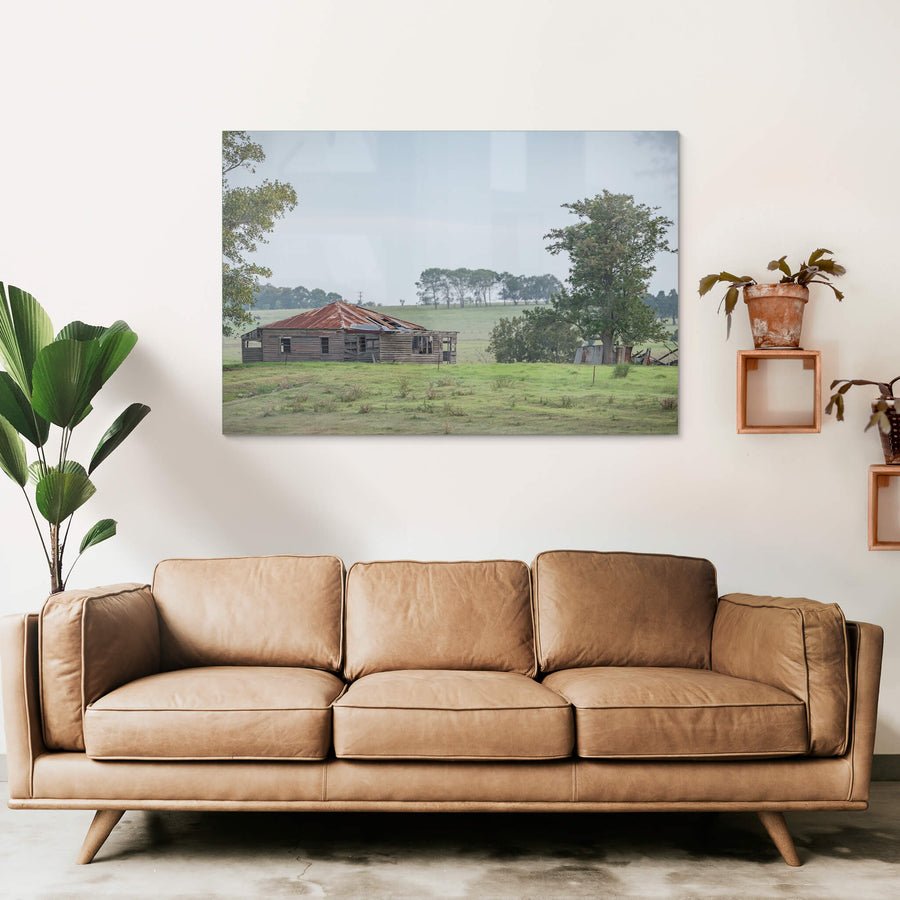 Hunter Homestead at A Place to Call Home, a weatherboard farmhouse sits low in open paddock, its hip roof a patchwork.
