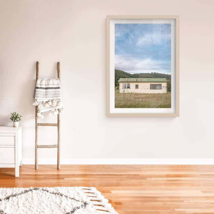 Hunter Shack at A Place to Call Home, a single-storey weatherboard building sits low in a clearing of dry grass and thistles.