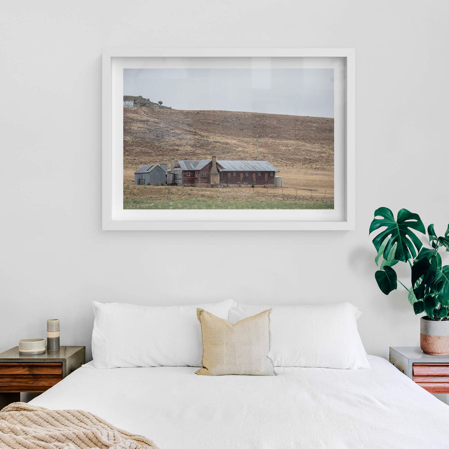 Shearers Quarters at A Place to Call Home, a low timber homestead sits against a bare hillside in rural New South Wales.