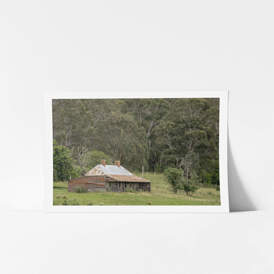 The Dragon Inn at A Place to Call Home, the historic Dragon Inn viewed across a field in Cathcart.