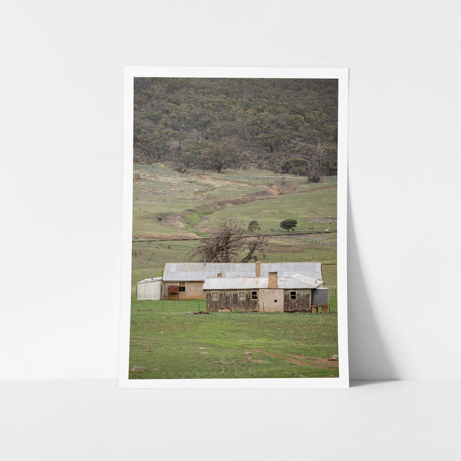 Valley Shearers Quarters at A Place to Call Home, a corrugated iron roof sits low over rendered walls and weathered timber.