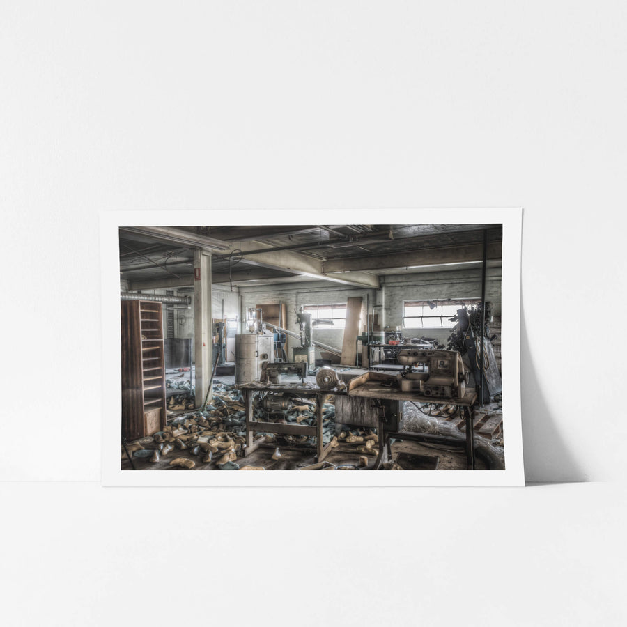 Sewing Desk at Abandoned Shoe Factory, a couple of sewing machines used for hand stitching shoes.