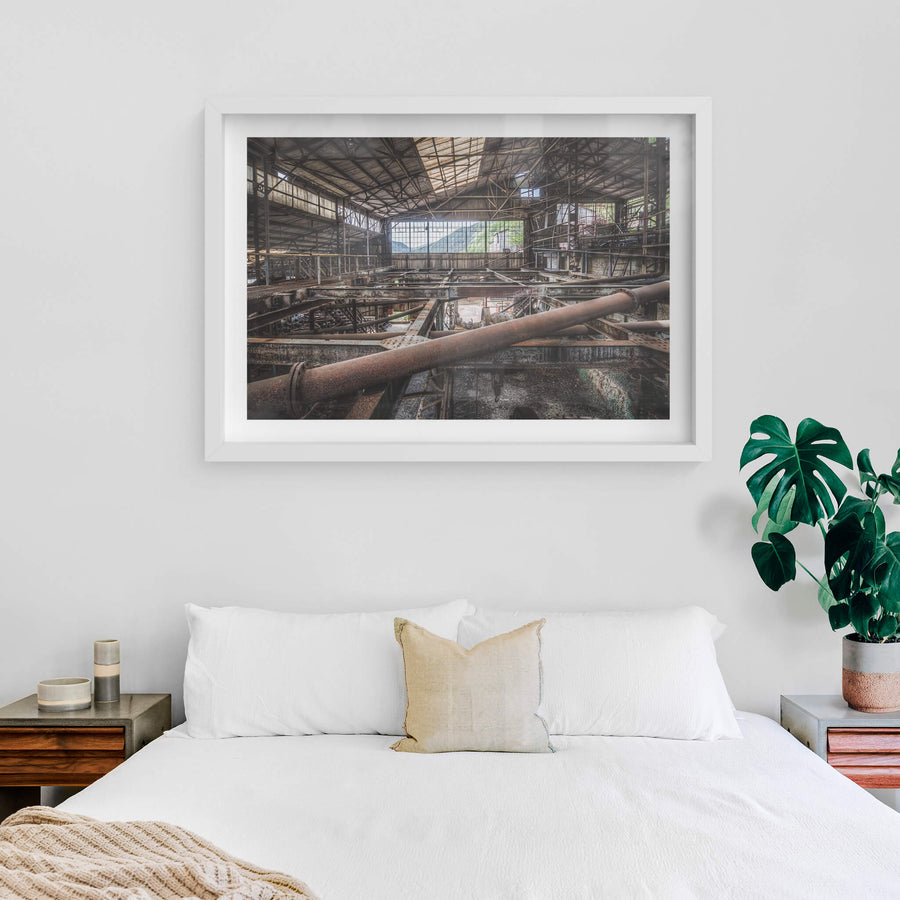 Mountain View at Ashio Copper Mine, steel trusses and heavy pipework fill the interior of a vast processing shed.