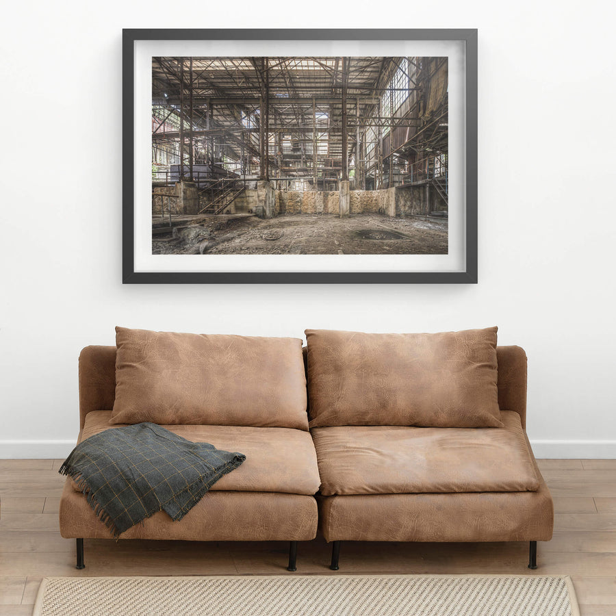 Void at Ashio Copper Mine, steel trusses span the full width of the processing hall, rising three storeys above a bare.