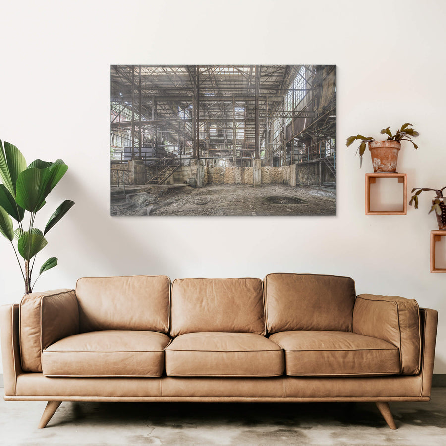 Void at Ashio Copper Mine, steel trusses span the full width of the processing hall, rising three storeys above a bare.
