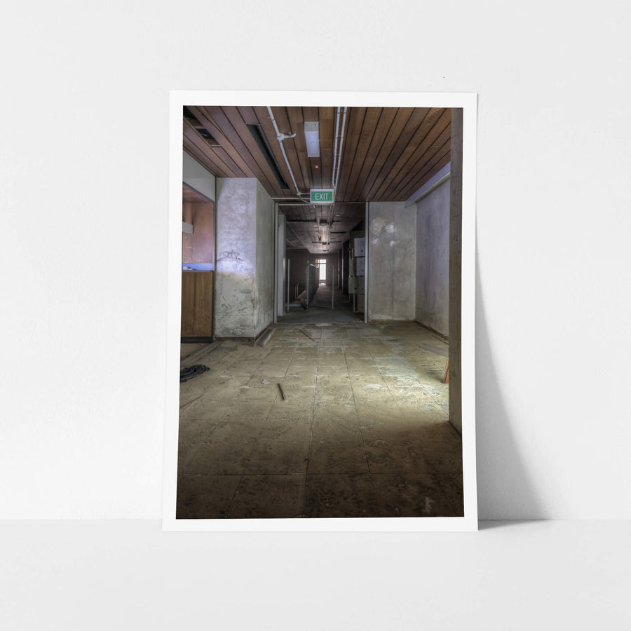 Change Rooms at Bankstown RSL, a long corridor stretches toward a distant source of natural light.