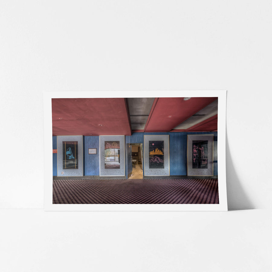 Foyer Art at Bankstown RSL, five framed artworks line the foyer wall, mounted on blue timber panelling punctuated.