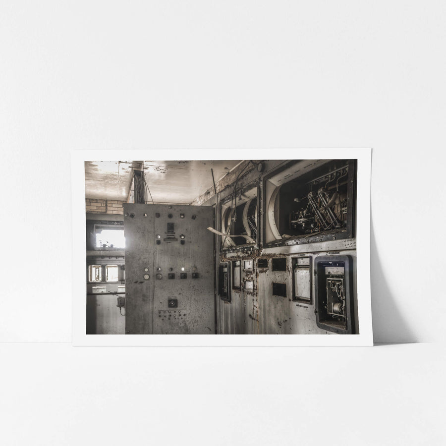 Control Room at Bathurst Gasworks, a steel control panel stands in a dim room, its surface grey with grime.