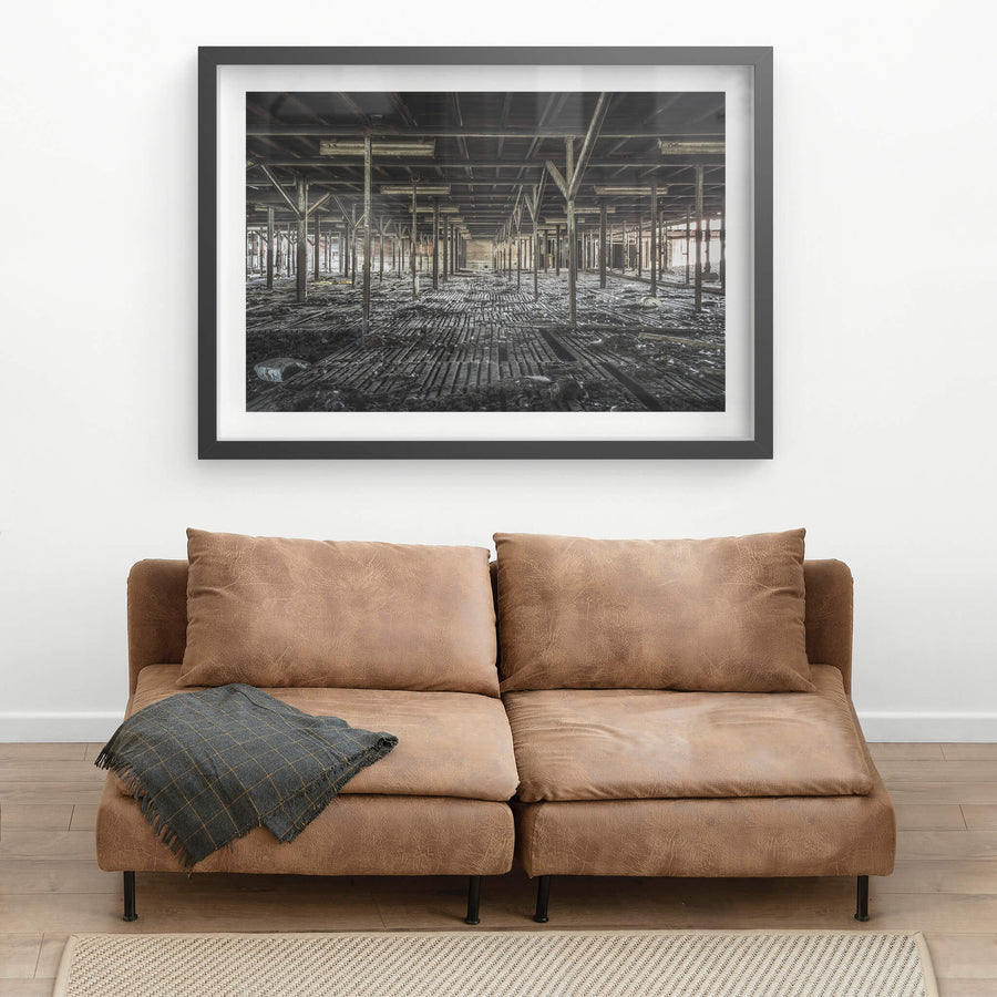 Bottom Holding Area at Blayney Abattoir, a grid of steel uprights stretches into the distance, framing the remains.