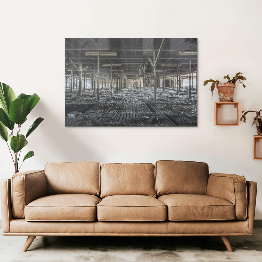 Bottom Holding Area at Blayney Abattoir, a grid of steel uprights stretches into the distance, framing the remains.
