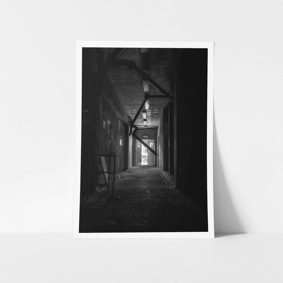 Dark Hallway at Blayney Abattoir, a narrow concrete corridor runs deep into shadow.