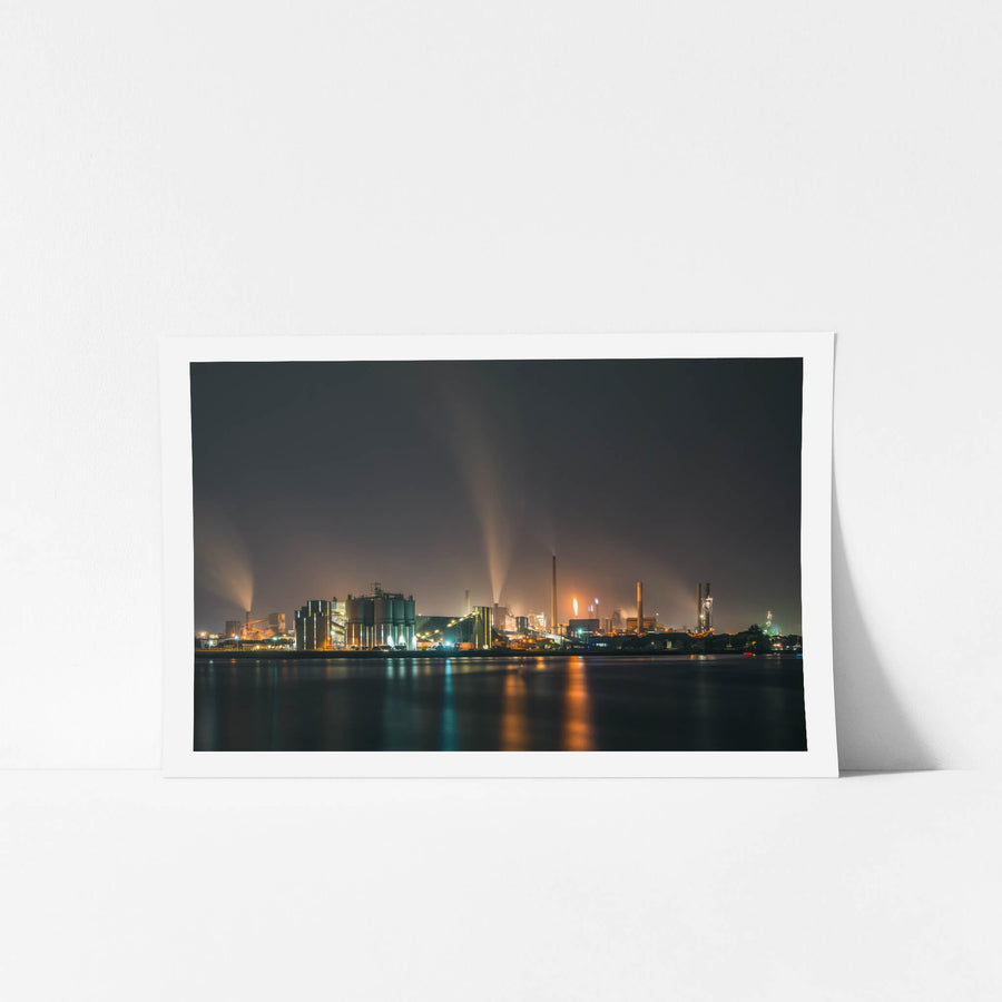 Port Kembla At Night at BlueScope Port Kembla, steam columns rise from the BlueScope steelworks and dissolve into low cloud.