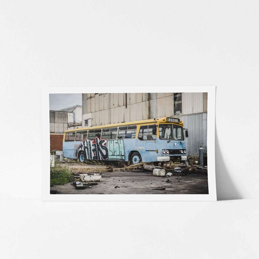 Bus at Bradmill Denim, a decommissioned bus sits against corrugated steel cladding in a yard at the Bradmill site.