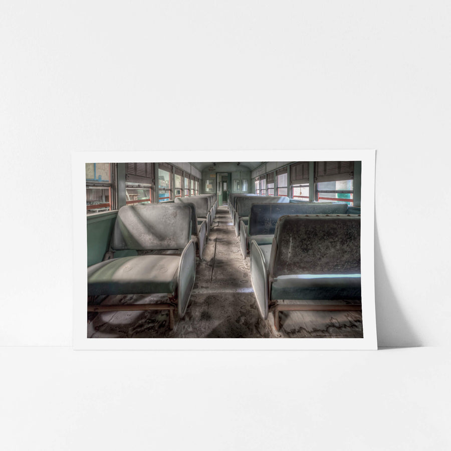 4052 Interior at Eveleigh Paint Shop, dust lingers on the seats of Driving Control Trailer Car D4052, its silence a stark contrast to the decades of movement it once knew.