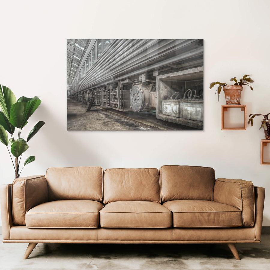 Batteries at Eveleigh Paint Shop, the underside of a stainless steel interurban carriage fills the frame.