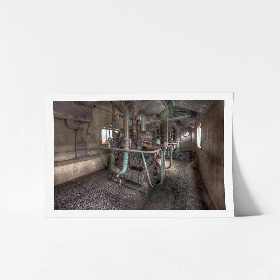 Generating Sets at Eveleigh Paint Shop, a diesel generating set sits bolted to chequerplate flooring inside the narrow engine compartment of a power van.