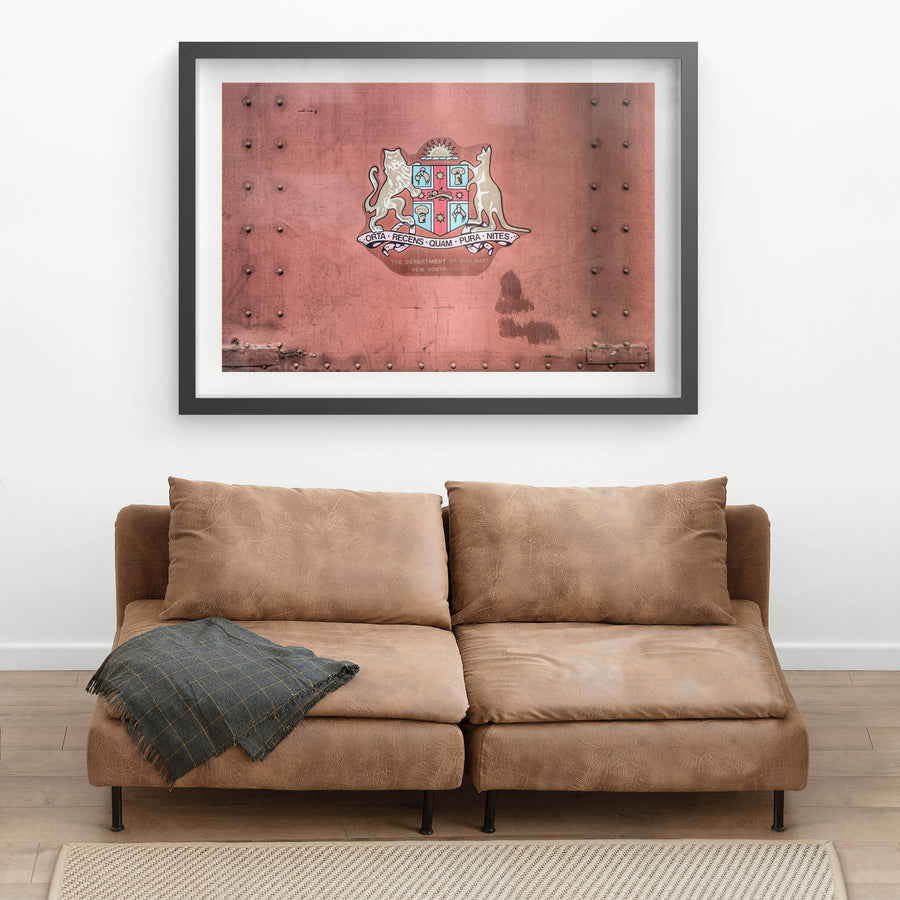 NSW State Emblem at Eveleigh Paint Shop, the New South Wales coat of arms sits centre on a riveted steel panel.