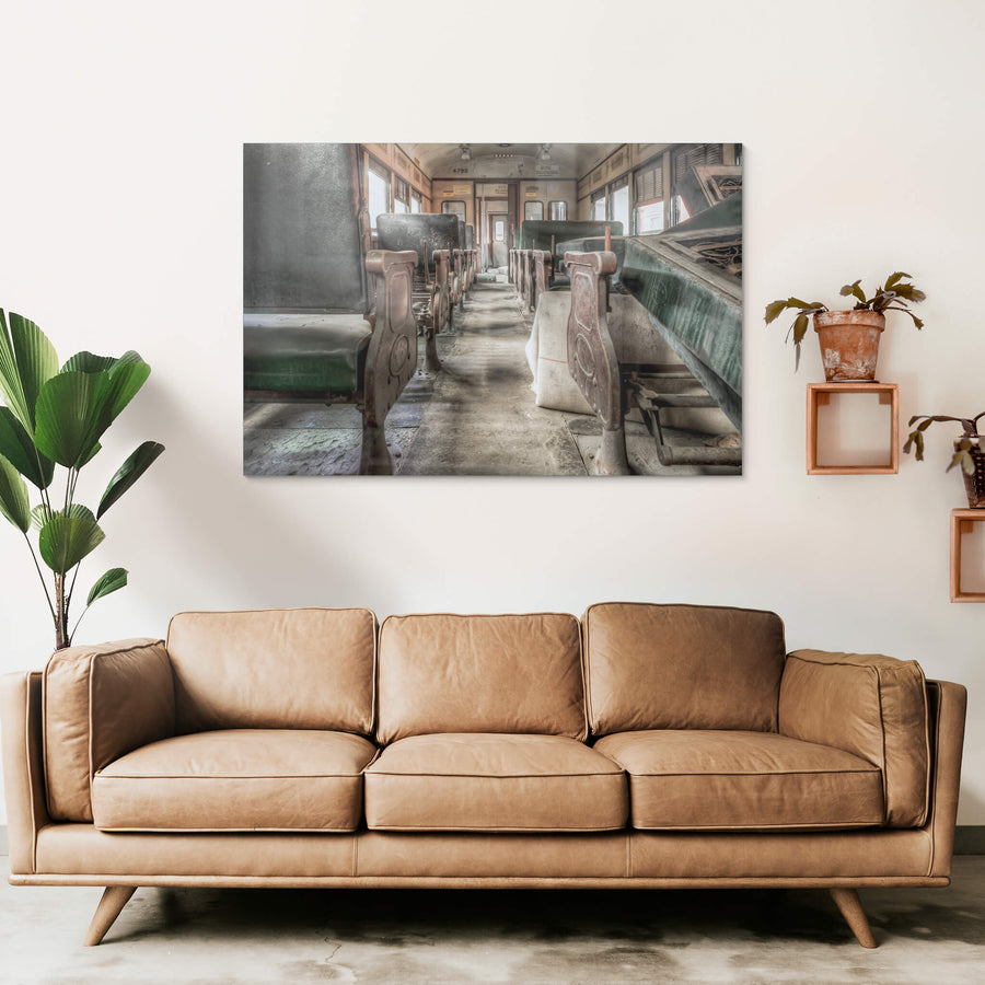 Sputnik at Eveleigh Paint Shop, green leather bench seats line both sides of carriage 4790, their cast-iron armrests decorated with pressed circular motifs.