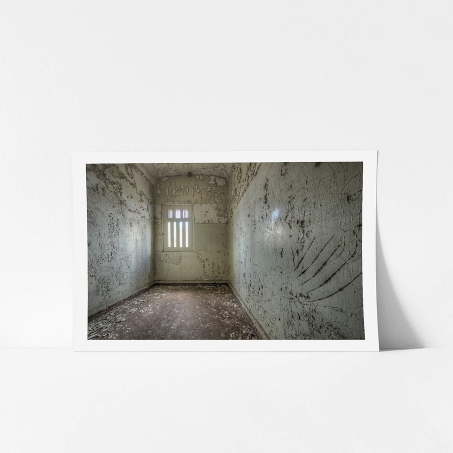Scratch at Female Ward 9 & 10, a small cell with pale cream walls.