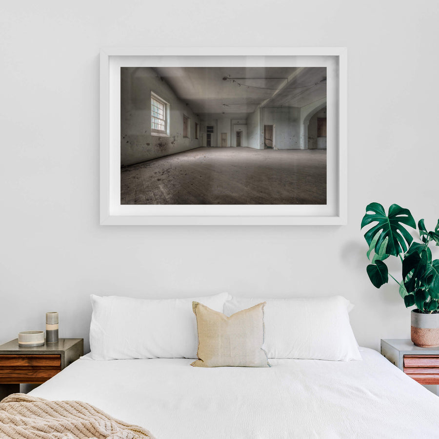 Soft Light at Female Ward 9 & 10, a single window throws pale light across a bare concrete floor.